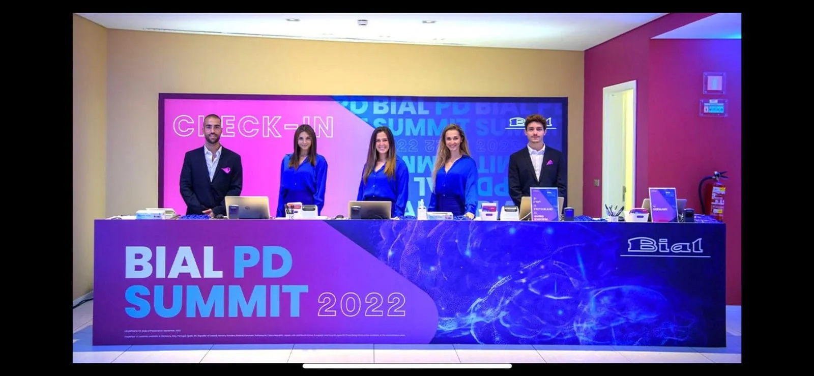 The BIAL PD Summit 2022 check-in desk, with the welcome team behind it.